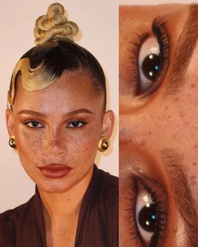 try on an intricate high bun hairstyle with a blonde streak.