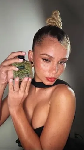 Try on a top knot hairstyle, styled elegantly atop the head in a neat, twisted bun, providing a chic and polished appearance.