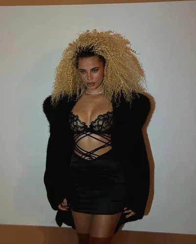 try on a voluminous curly blonde hairstyle.