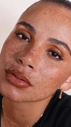 Try on this slicked-back hairstyle, featuring hair smoothly pulled back with a glossy finish that complements a clean and elegant look.