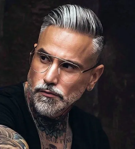 Try on a slicked-back hairstyle in gray tones with a neatly trimmed beard for a refined look.