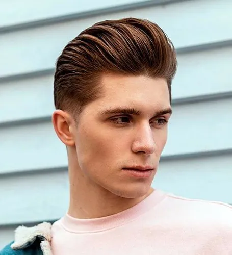 Try on a well-groomed slicked back hairstyle with a distinct side part, showing neat and shiny strands styled backward.