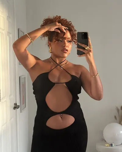 Try on a short curly hairstyle with soft curls adding volume and framing the face.