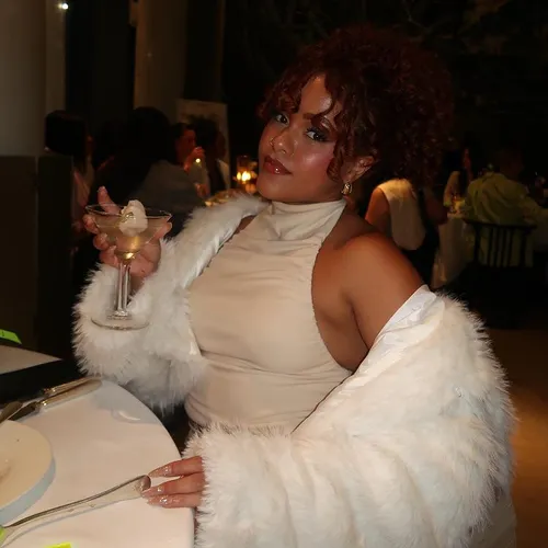 Try on this elegant, short curly hairstyle that frames the face beautifully, accentuating soft, bouncy curls that add a touch of sophistication.