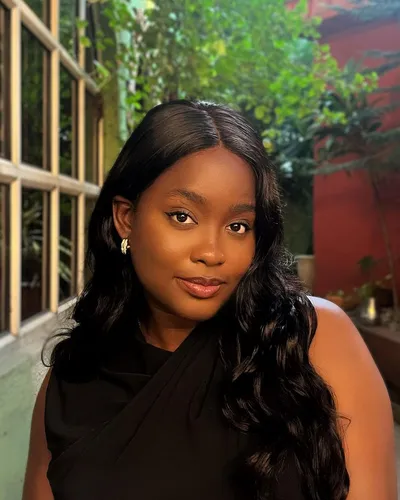 Try on this elegant long wavy hairstyle that gently cascades down one shoulder, featuring a subtle side part that enhances the smooth, flowing waves. This sophisticated style is perfect for both formal and casual occasions.