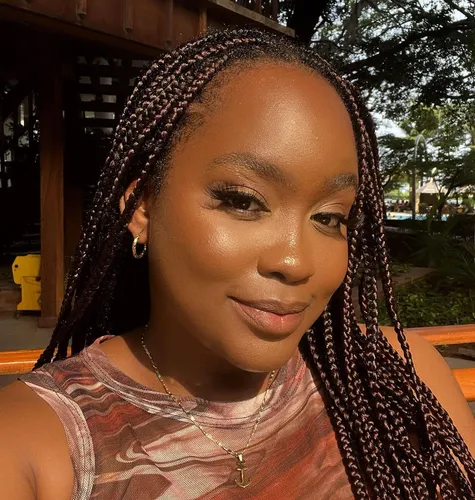 Try on this elegant long braided hairstyle, styled into neat, thin braids that cascade beautifully around the face.