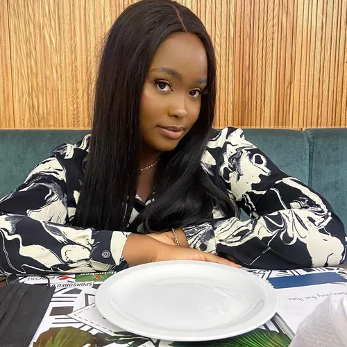 Try on the long straight hairstyle, as seen on the woman with her hair beautifully flowing over her shoulders.