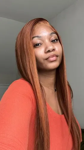 Try on this straight, long hairstyle in a striking auburn shade.