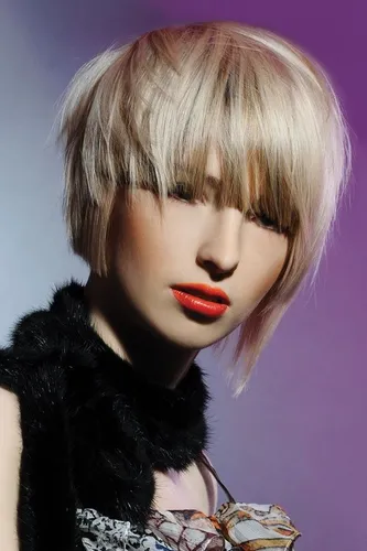 Try on this trendy short bob hairstyle, featuring blonde hair with subtle light pink highlights.