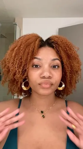 Try on this shoulder-length, curly hairstyle featured in the image.