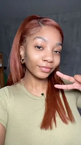 Try on this long straight red hairstyle, with styled layered ends