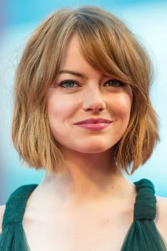 Try on a chin-length bob hairstyle with soft bangs, providing a fresh and modern look.