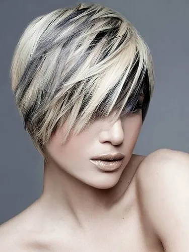 Try on this trendy hairstyle featuring a short, layered haircut with blonde, black, and grey highlights. Perfect for those looking for a bold, modern look.