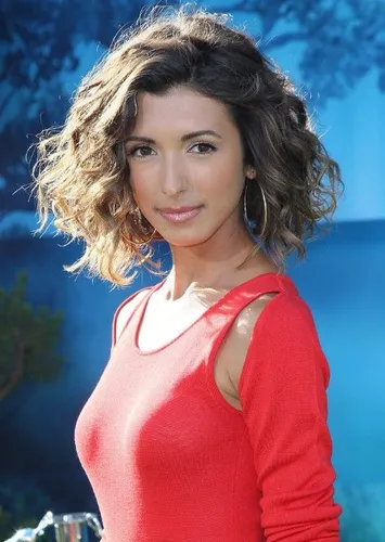 Try on this chic, short curly hairstyle that bounces with volume and texture.