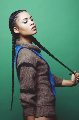 Try on this hairstyle featuring long, thick braids that perfectly capture an eye-catching and sophisticated look. The hairstyle consists of sleek, tightly braided hair that extends into lengthy braids, presenting a polished and elegant appearance.