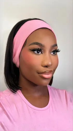 Try on a sleek bob haircut modeled by a person wearing a pink headband and t-shirt.