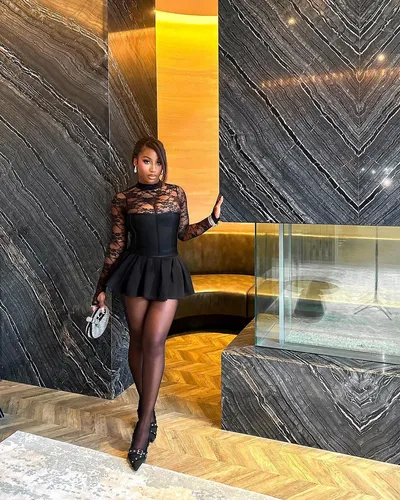 Try on this short hairstyle, featuring stylized side-swept bangs giving a polished and sophisticated look.