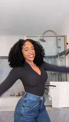 Try on this cheerful look featuring shoulder-length curly hair, ideal for a vibrant and fun appearance.