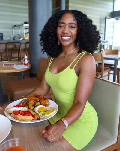 Try on this medium-length curly hairstyle for a vibrant and voluminous look.