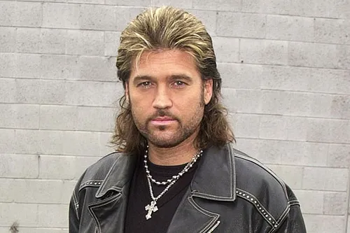 try on a classic mullet hairstyle featuring shorter hair on the top and sides with longer strands flowing at the back, styled to give a voluminous look on top. The texture transitions smoothly from the top to the flowing ends.