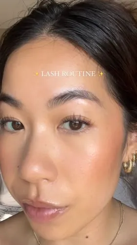 Try on a pulled-back hairstyle where the hair, appearing dark, is neatly swept back from the forehead and secured at the back, potentially indicating a bun or ponytail style.