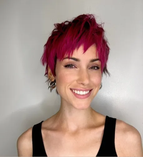 Try on this vibrant pink, short choppy haircut
