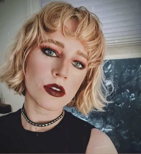 Try on this blonde, curly bob hairstyle complemented with light waves, providing a soft, feminine look.