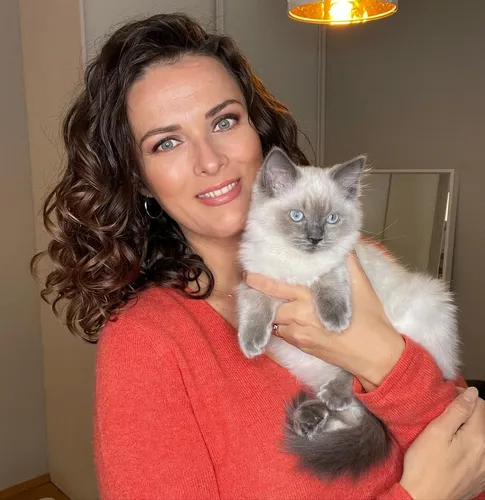 Try on this hairstyle featuring medium-length curly hair.