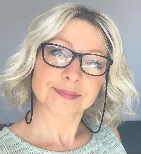 try on a wavy bob hairstyle with light blonde highlights, styled with volume and soft waves.