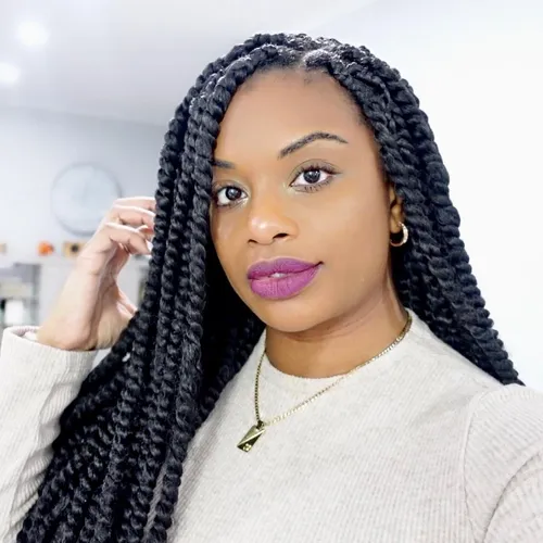 Try on this hairstyle featuring long, thick braids hanging loosely. The hair is styled neatly, showcasing the dense, uniform braids that add a textured look.