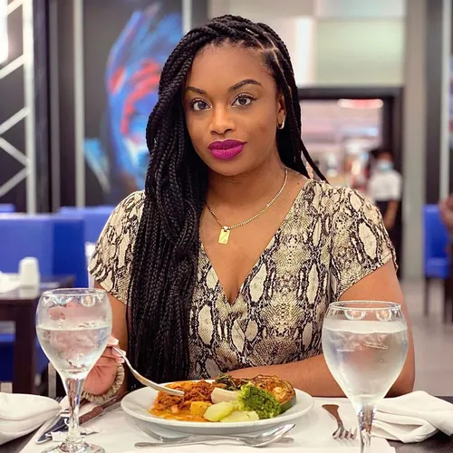 Try on long braids of medium thickness cascading over the shoulders, styled with a middle part.