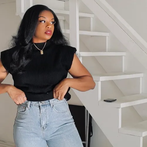 Try on this hairstyle with long, flowing waves, complemented by a subtle volume that enhances the overall elegance. The hair parts slightly off-center, framing the face beautifully.