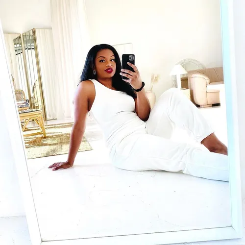 Try on this sleek long straight hairstyle, featuring a woman with dark hair cascading over her shoulders as she poses for a selfie.