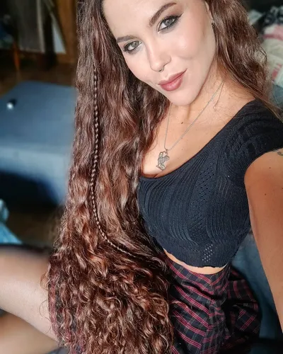 Try on this glamorous combination of long wavy and partially braided hair, featuring a blend of loose and intertwined strands for a dynamic and stylish appearance.