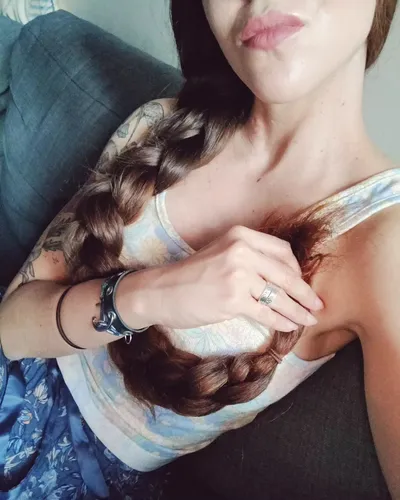 Try on this elegant side braided hairstyle that elegantly flows over the shoulder.