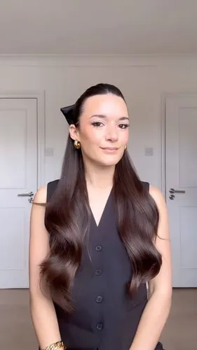 Try on this long straight hairstyle with subtle waves at the ends, providing a sleek and elegant look.