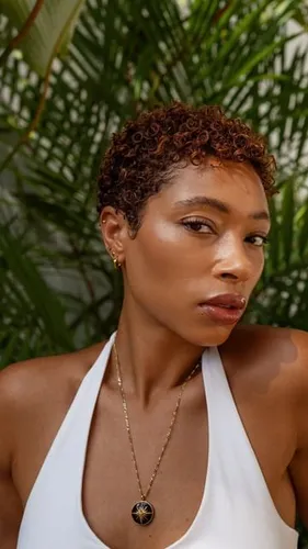 Try on this short curly hairstyle, with tightly coiled curls adding a voluminous texture.