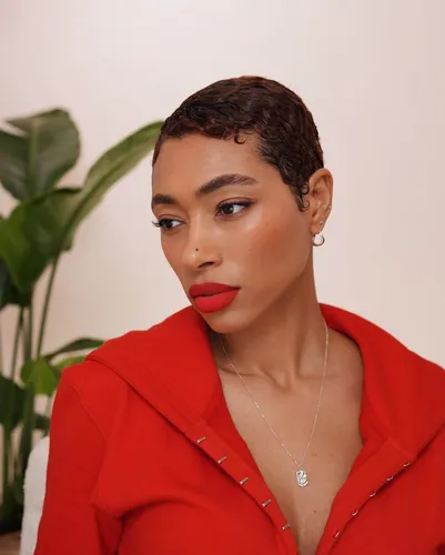 Try on a short wavy hairstyle, neatly styled with defined waves