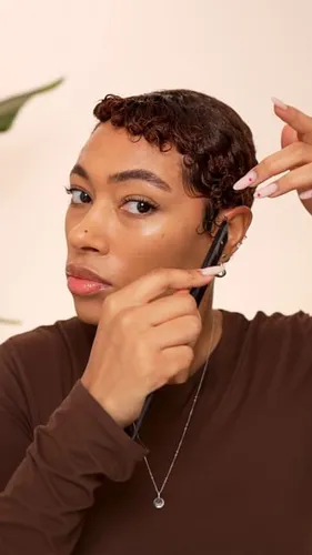 Try on this elegant braided updo hairstyle, neatly styled to complement a classy appearance.