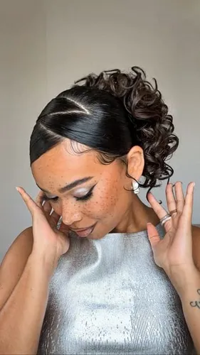 Try on this elegant hairstyle featuring a sleek updo with bouncy curls at the back, neatly parted hair at the front enhances the chic look.