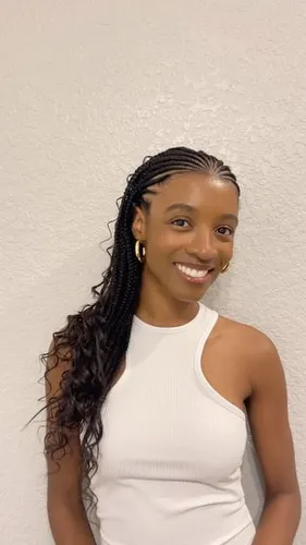 Try on this hairstyle that features long, partially braided hair with loose wavy ends.