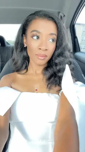 Try on this wavy, medium-length hairstyle featuring soft curls that gently frame the face, adding a touch of elegance and volume around the cheeks and jawline.