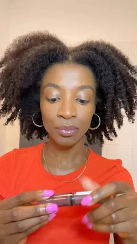 Try on this natural afro hairstyle, featuring thick, voluminous curls that frame the face beautifully.