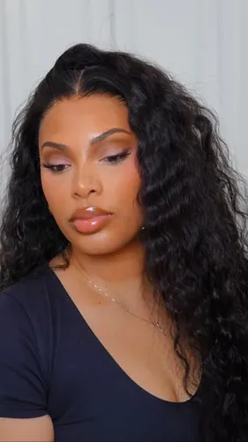 Try on this long wavy hairstyle featuring voluminous curls that softly frame the face, enhancing any look with a touch of glamour.