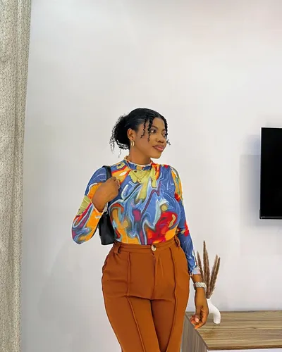 Try on a hairstyle featuring curly hair gathered into an updo, providing a neat and elegant appearance.