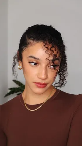 try on a curly, partially pulled back hairstyle