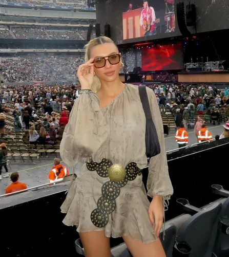 Try on this hairstyle, featuring a woman with long, straight hair styled in a simple, sleek manner that highlights her features elegantly.