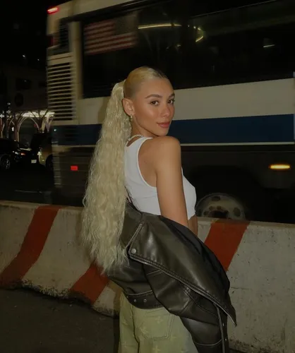 Try on this striking hairstyle featuring a blonde, long ponytail