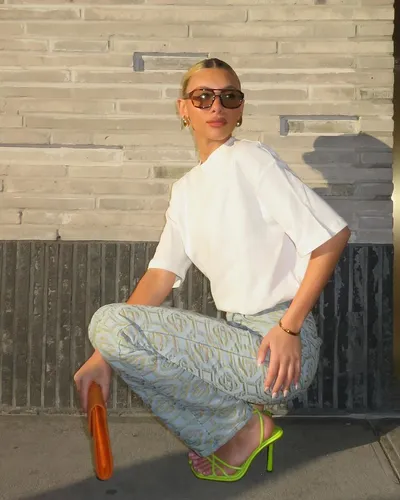 Try on a slicked back hairstyle, with the hair neatly pulled back in a smooth, sleek fashion.