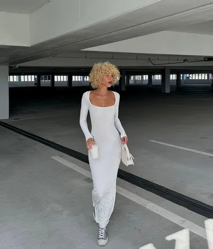 Try on this voluminous curly blonde hairstyle perfect for a chic look.
